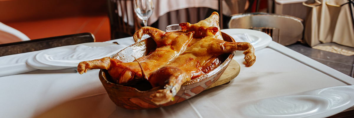 Whole roast suckling pig with traditional Segovian-style finish